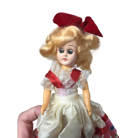 Vintage Collectible Doll With Blonde Hair wearing floral printed dress/red bow - Picture 3 of 8